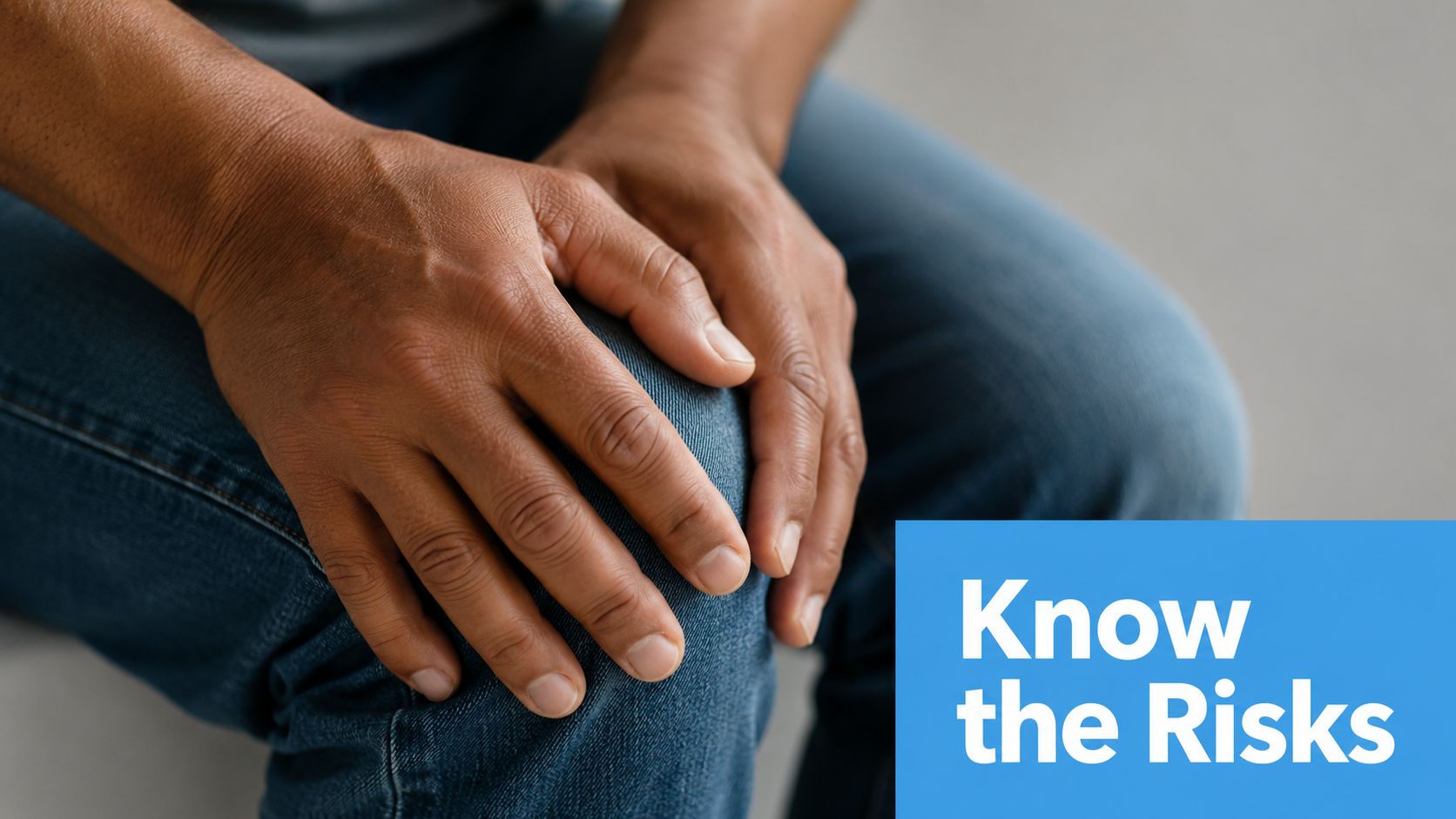 A close-up view of a person's hands resting on their knee, emphasizing health concerns and risks.